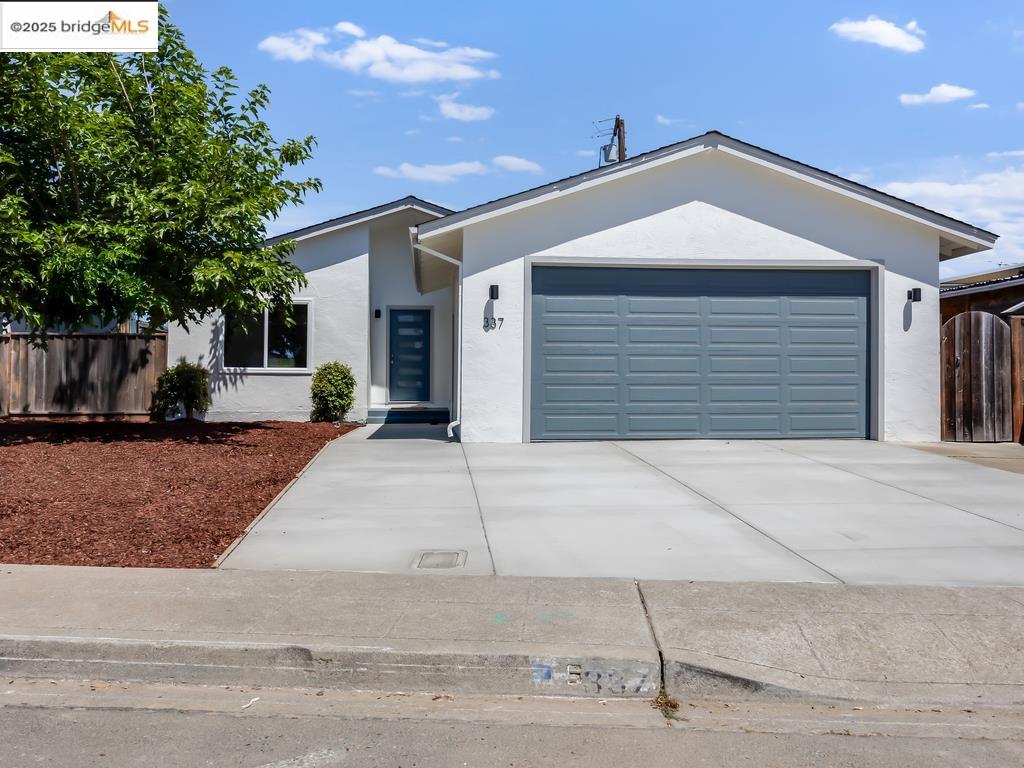 337 Silvertip Court Milpitas, CA 95035 - Photo 1 of 1 a front view of a house with a yard and garage