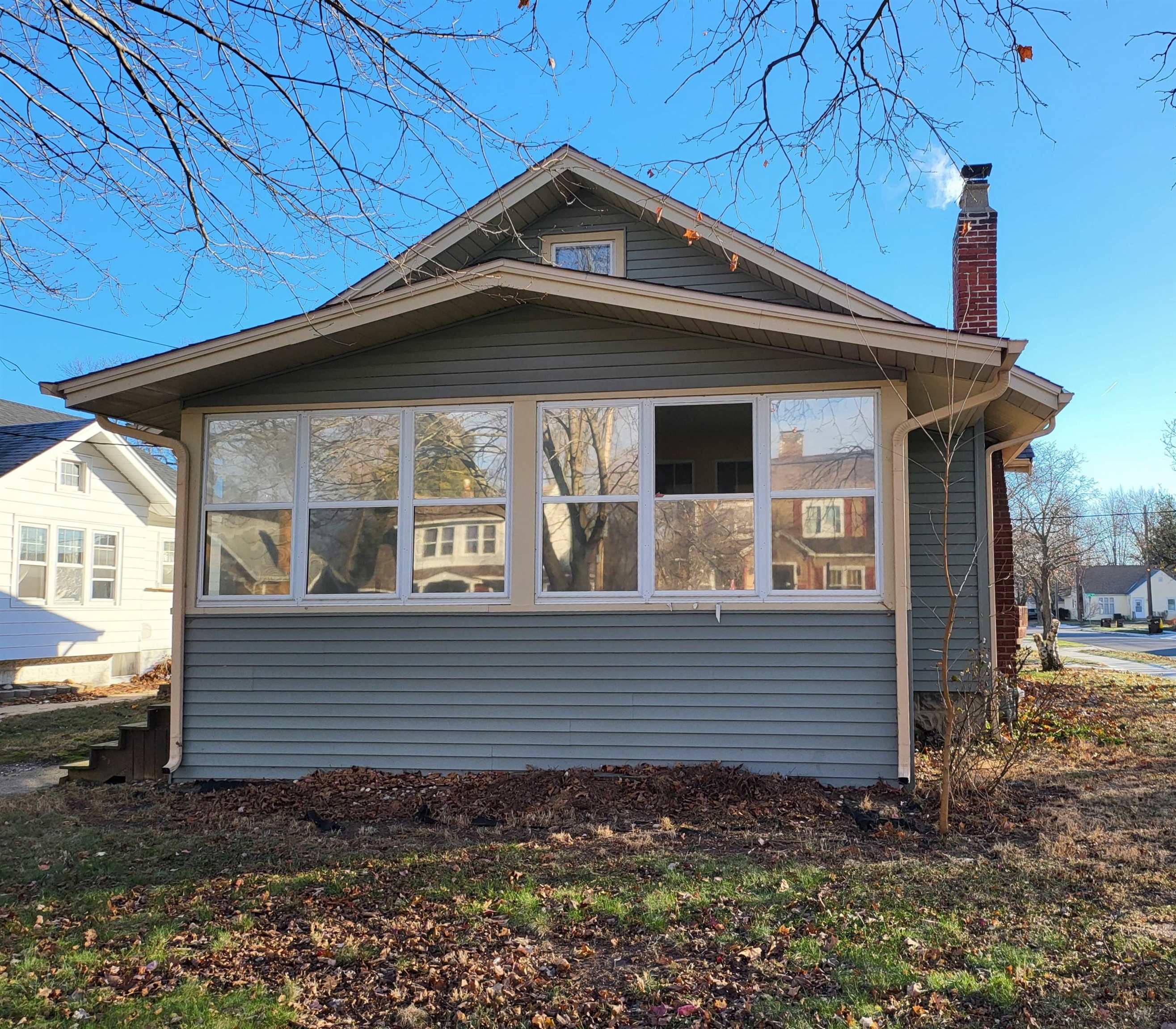 1803 Ridge Avenue Rockford, IL 61103 - Photo 1 of 11 a front view of a house with garden