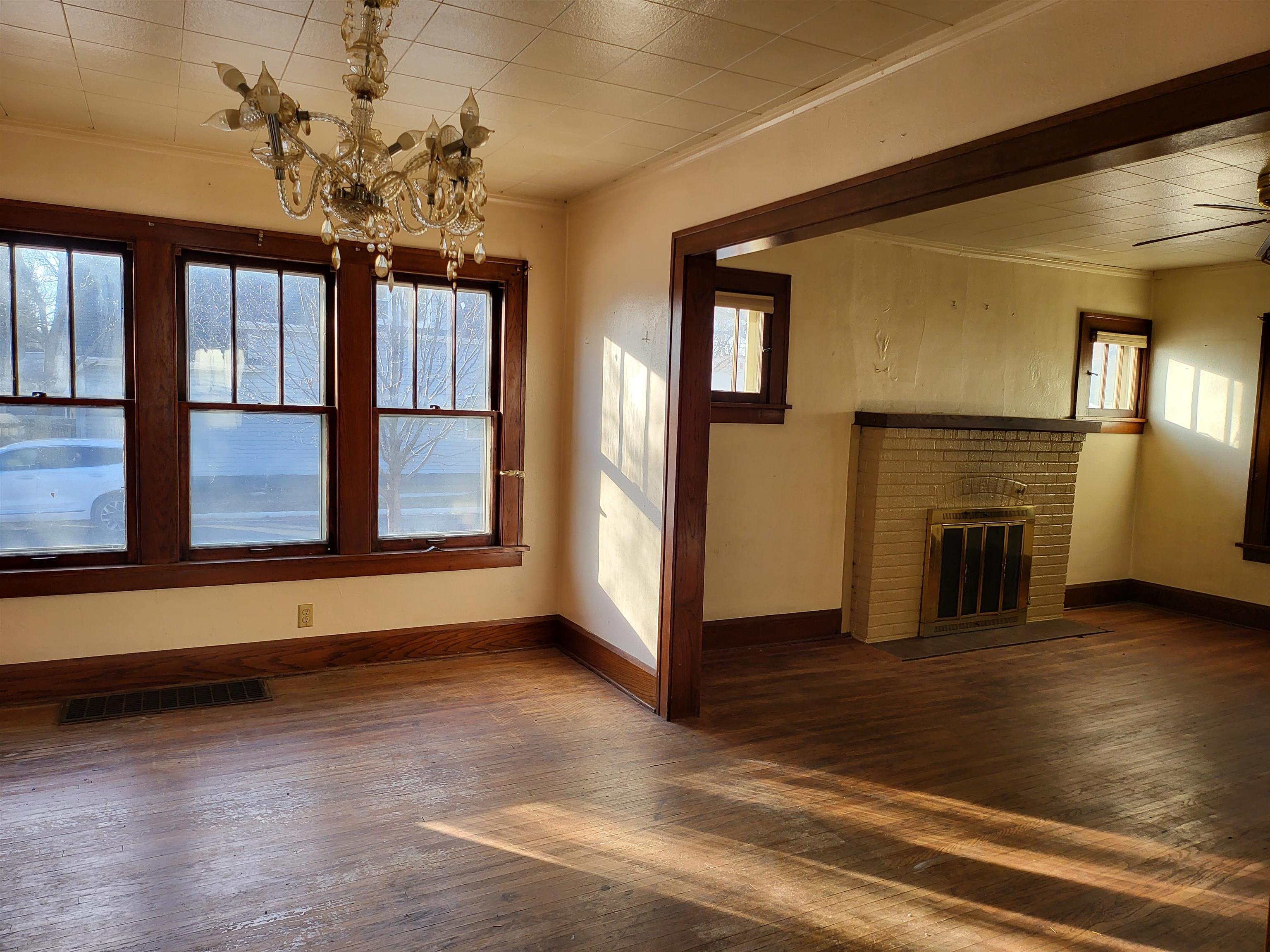 1803 Ridge Avenue Rockford, IL 61103 - Photo 11 of 11 a view of an empty room with window and wooden floor
