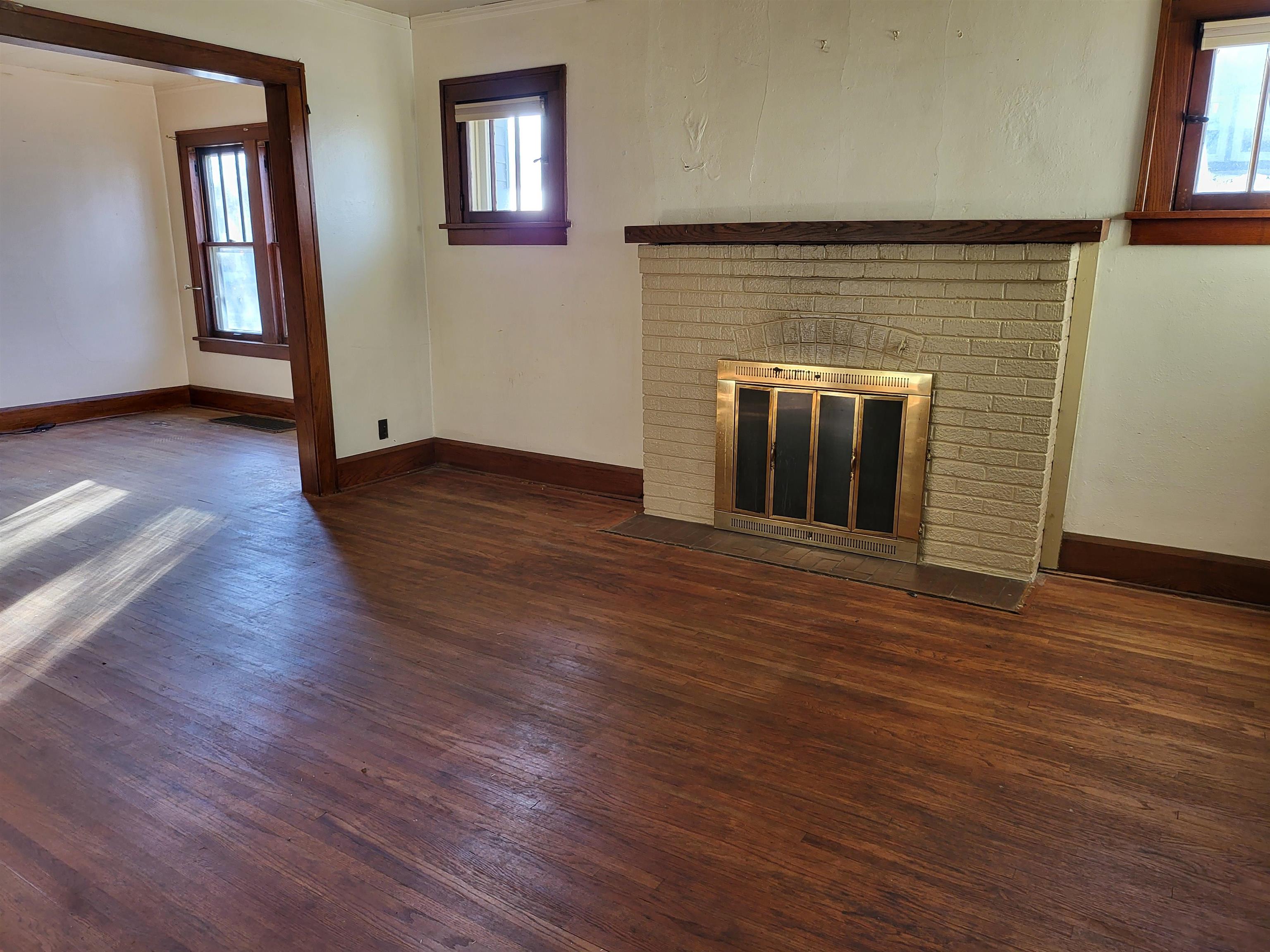1803 Ridge Avenue Rockford, IL 61103 - Photo 7 of 11 an empty room with wooden floor and windows