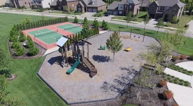 an aerial view of a house with a lake view