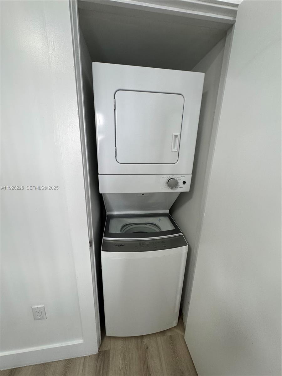 1969 Northwest 2nd Court, Unit 6 Miami, FL 33136 - Photo 8 of 17 a utility room with dryer and washer