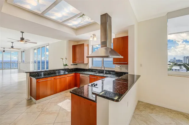 a living room with furniture a flat screen tv and a large window