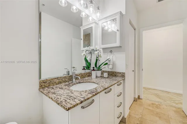 a view of a room with window and a ceiling fan