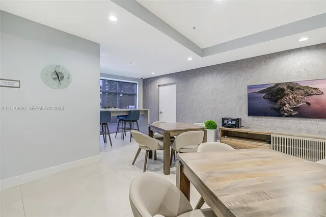 a view of a swimming pool with outdoor seating