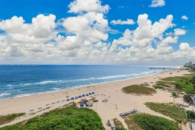 a kitchen with stainless steel appliances granite countertop a sink and a stove