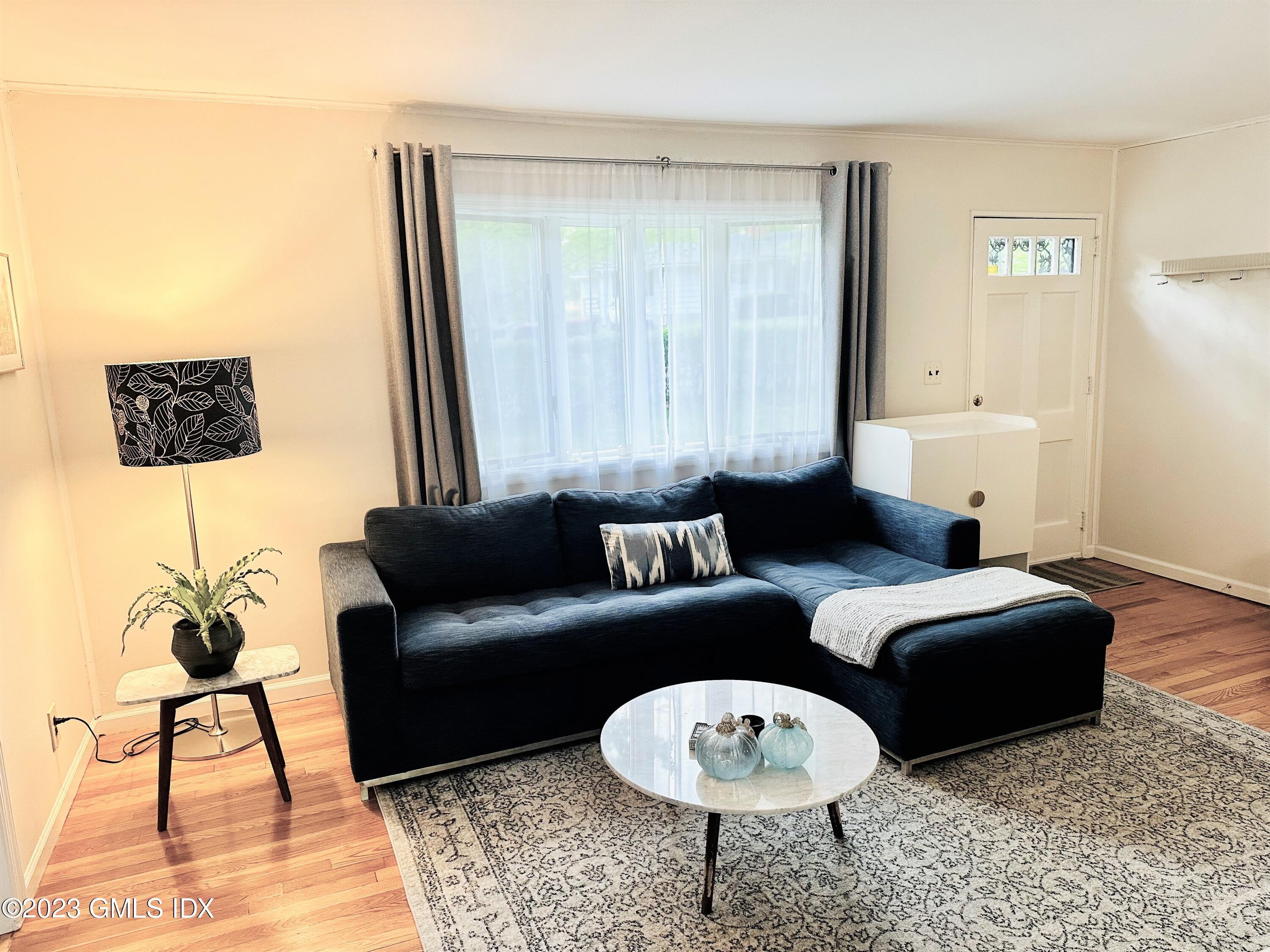 36 Morningside Drive Greenwich, CT 06830 - Photo 2 of 10 a living room with furniture and a rug