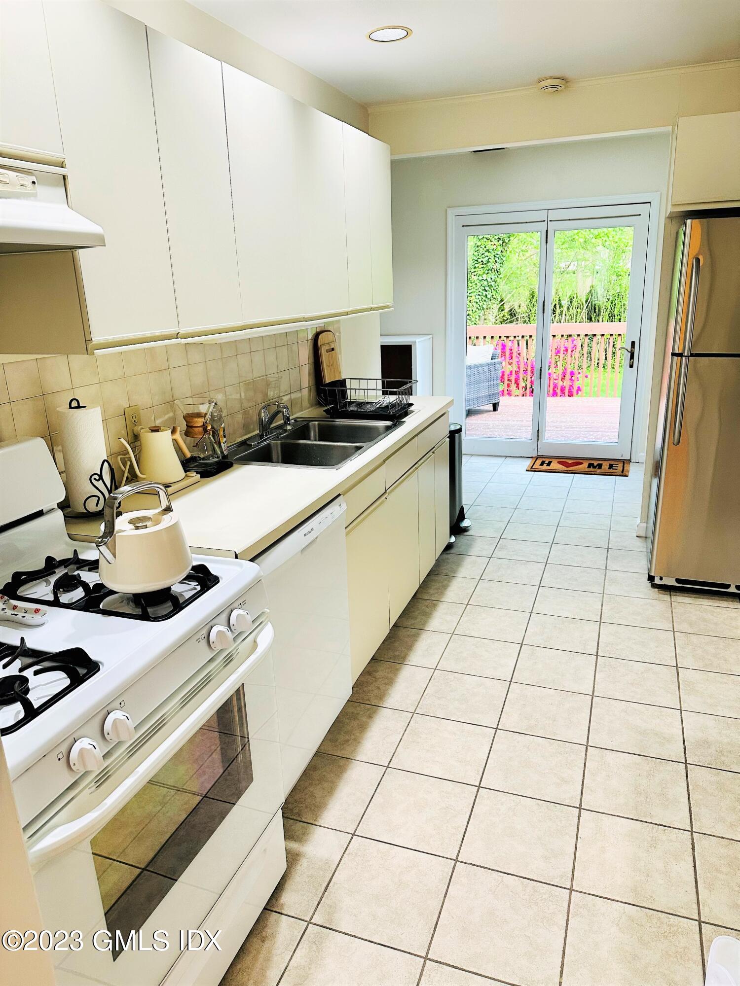36 Morningside Drive Greenwich, CT 06830 - Photo 5 of 10 a kitchen with a sink and a stove top oven