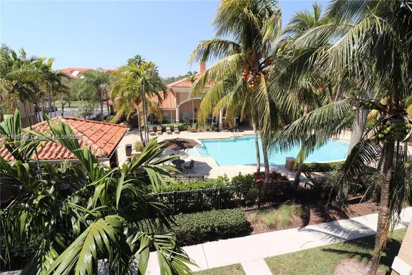 a view of a yard with palm trees