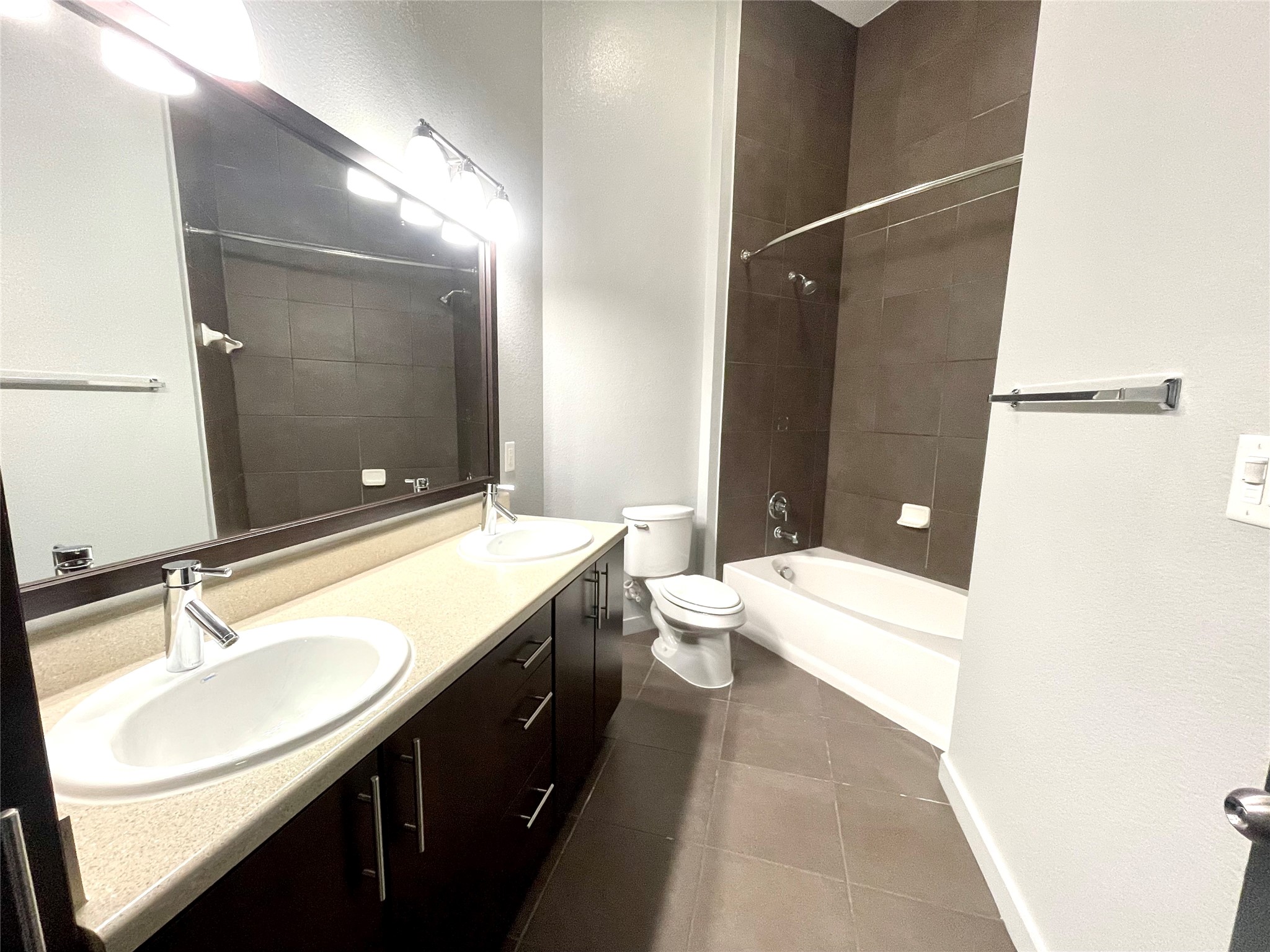 2525 McCue Road, Unit 327 Houston, TX 77056 - Photo 7 of 9 a bathroom with a sink a toilet and shower