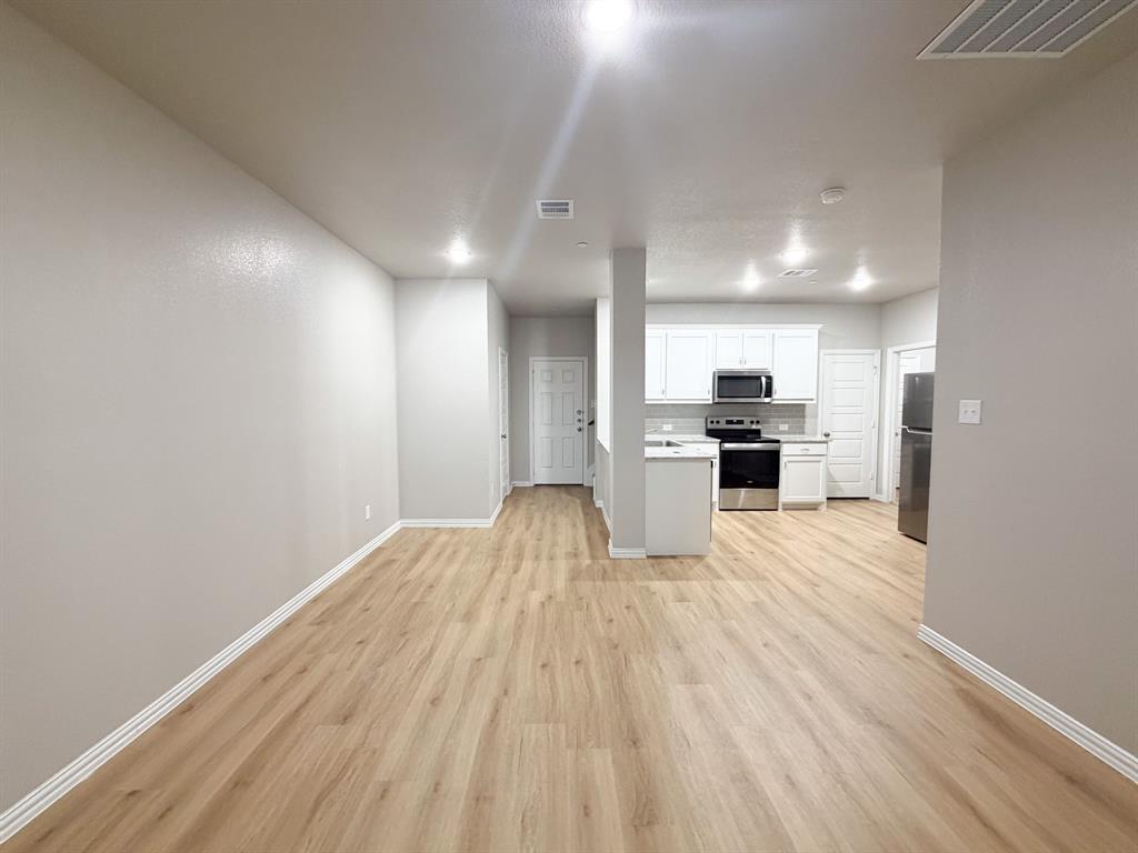 432 Restoration Road Waxahachie, TX 75165 - Photo 12 of 20 a view of kitchen with refrigerator microwave and stove