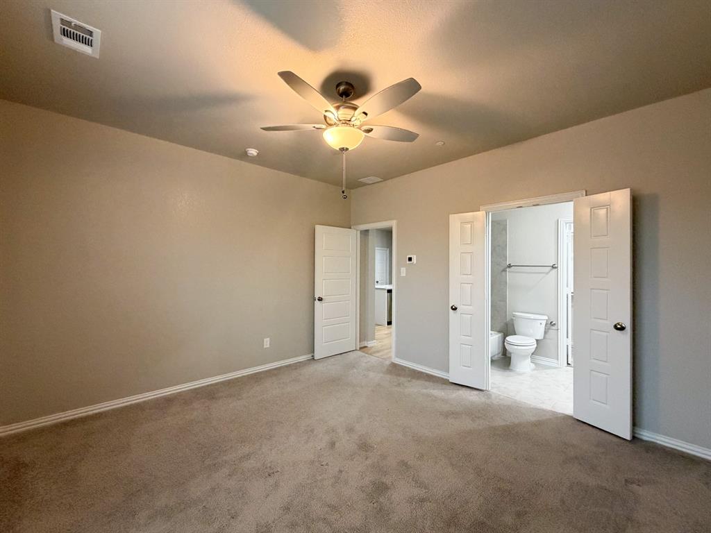432 Restoration Road Waxahachie, TX 75165 - Photo 10 of 20 an empty room with fan and a ceiling fan