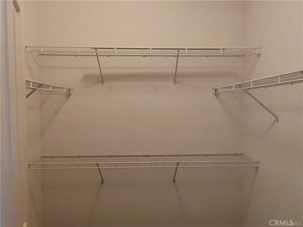 a view of a room with racks on the wall