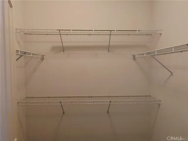 a view of a room with racks on the wall