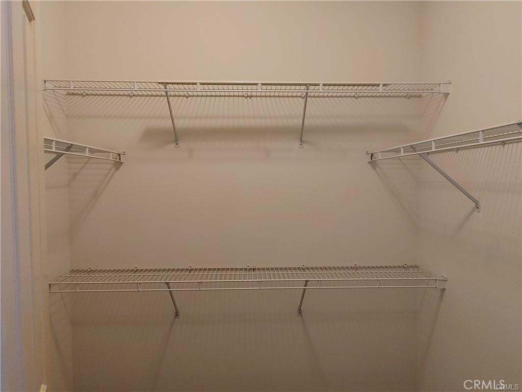 47 Straw Flower Irvine, CA 92620 - Photo 11 of 16 a view of a room with racks on the wall