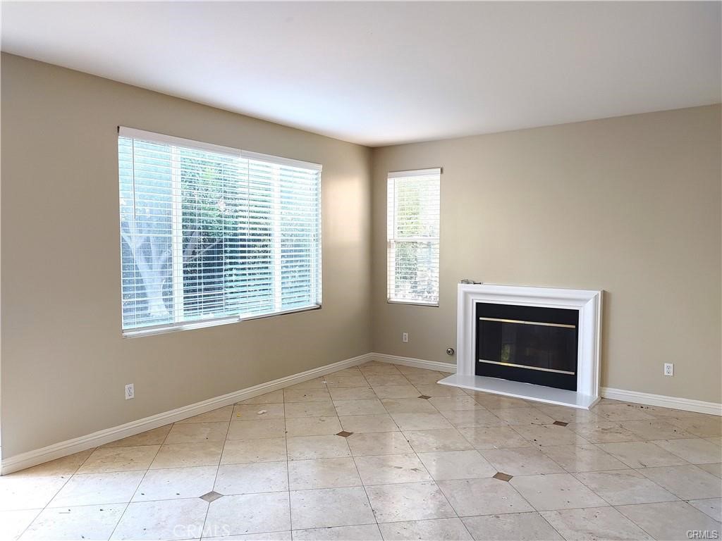 47 Straw Flower Irvine, CA 92620 - Photo 5 of 16 a view of an empty room with a window and fire place