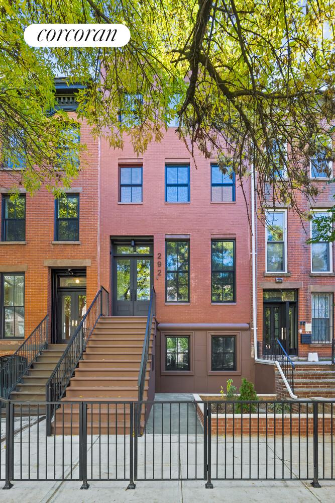 292 Gates Avenue Brooklyn, NY 11216 - Photo 24 of 25 a front view of a house with a garden