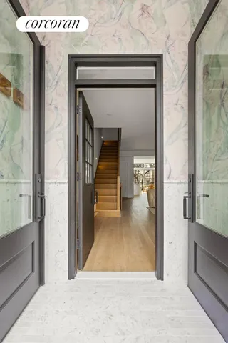 a view of a hallway view with staircase