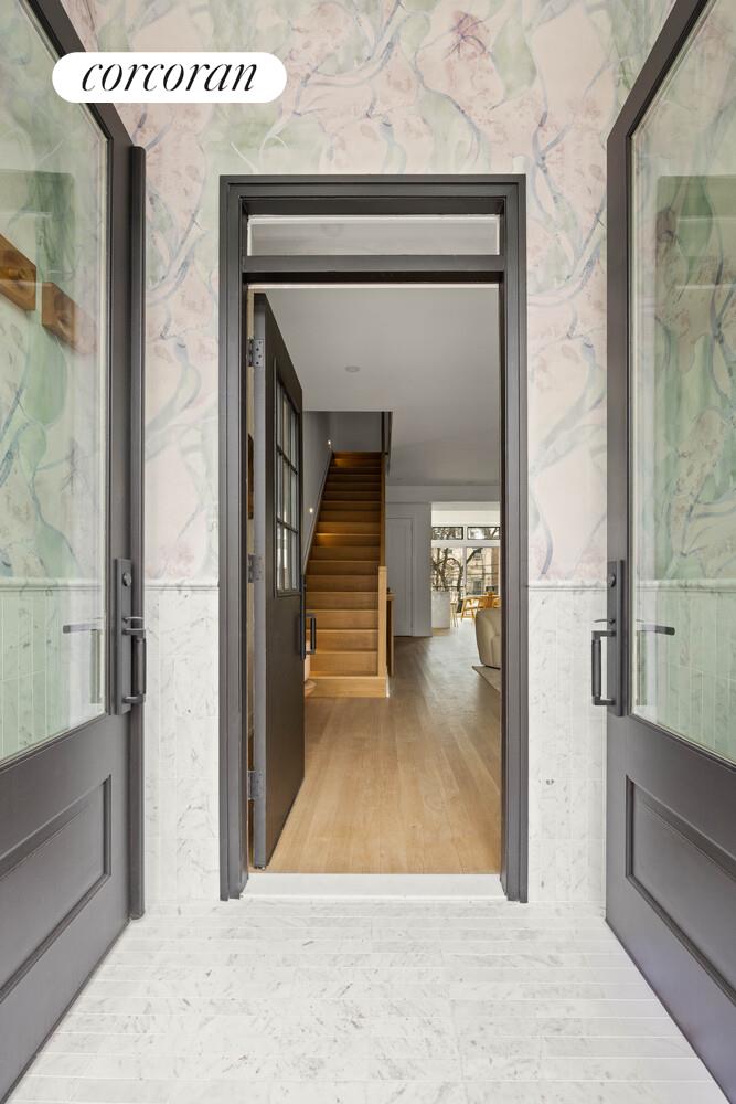 292 Gates Avenue Brooklyn, NY 11216 - Photo 4 of 25 a view of a hallway view with staircase