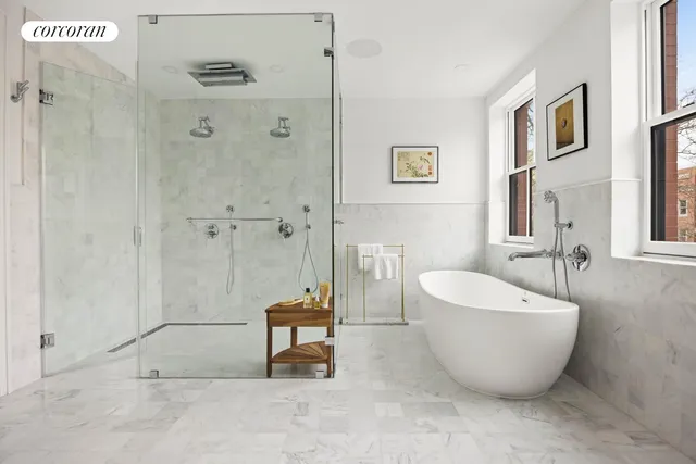 a spacious bathroom with a bathtub and shower