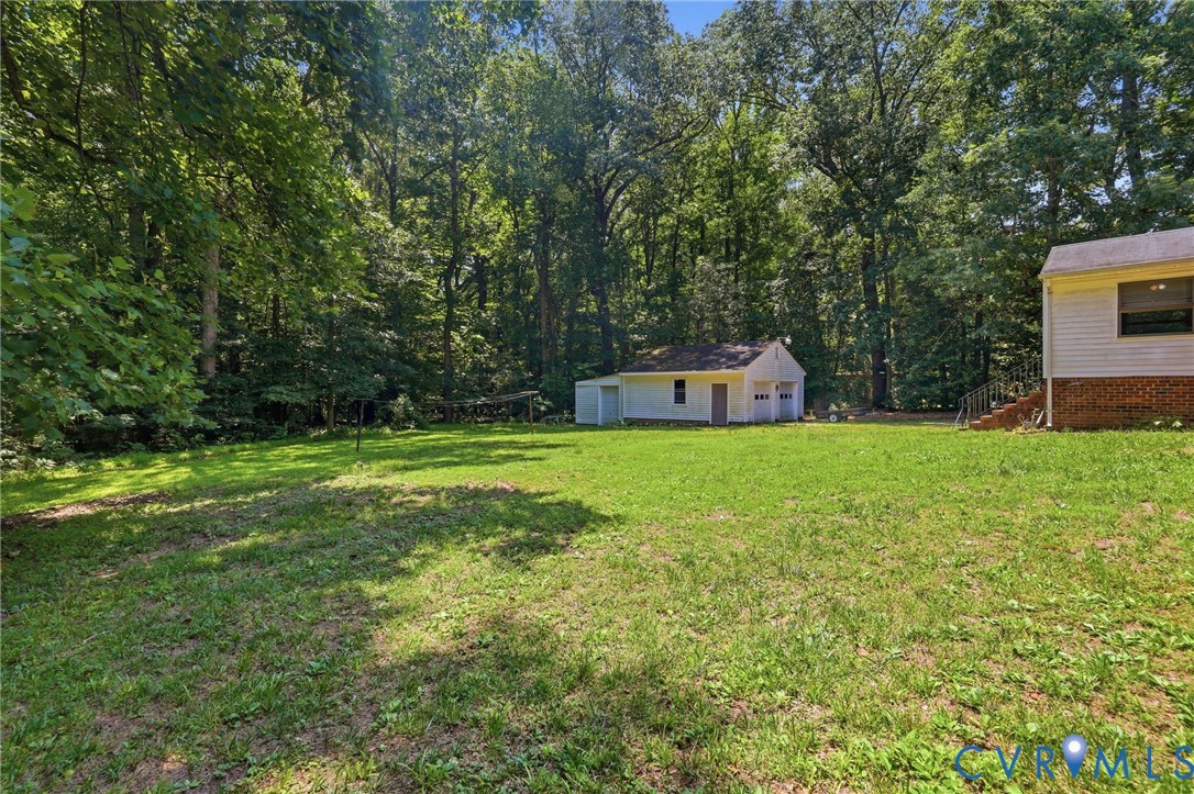 10111 Tunstall Road New Kent, VA 23124 - Photo 43 of 52 Expansive green lawn surrounded by mature trees