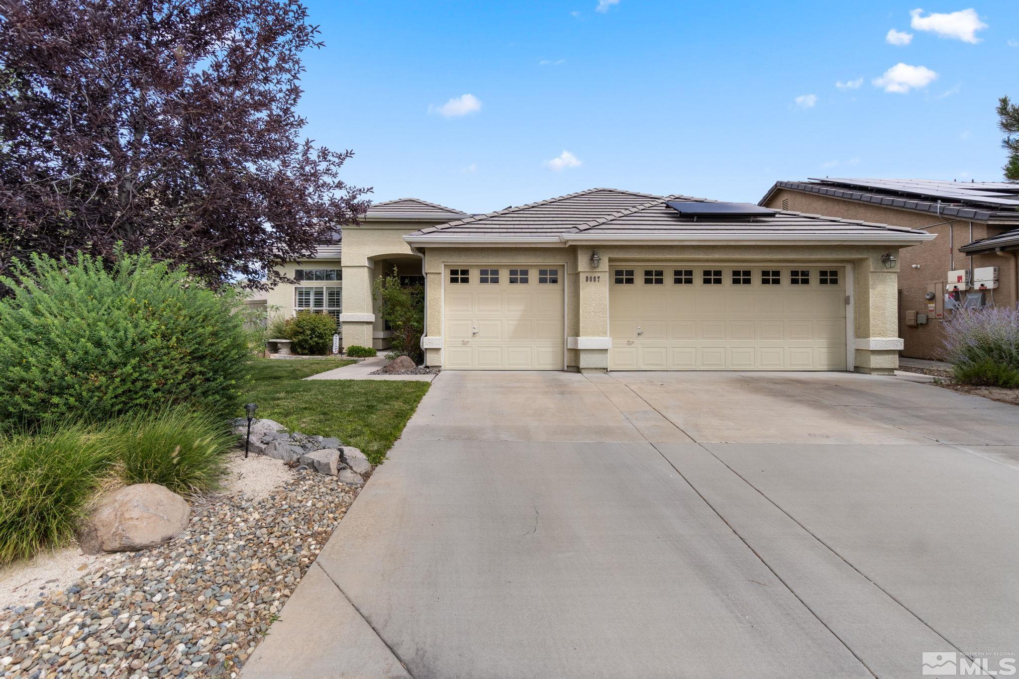 9607 Glen Ridge Drive Reno, NV 89521 - Photo 1 of 22 a front view of a house with garden