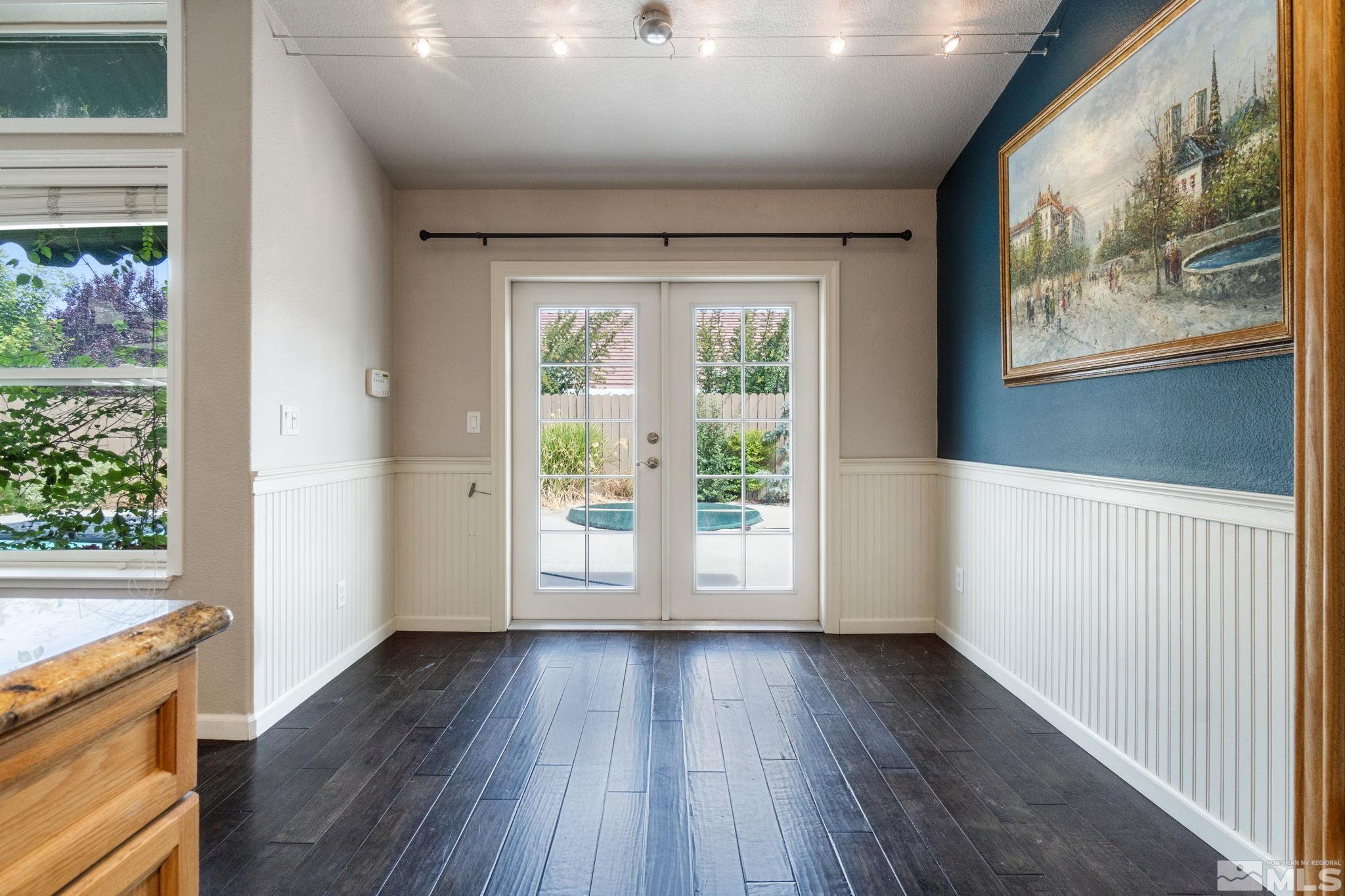 9607 Glen Ridge Drive Reno, NV 89521 - Photo 11 of 22 a view of an empty room with wooden floor and a window