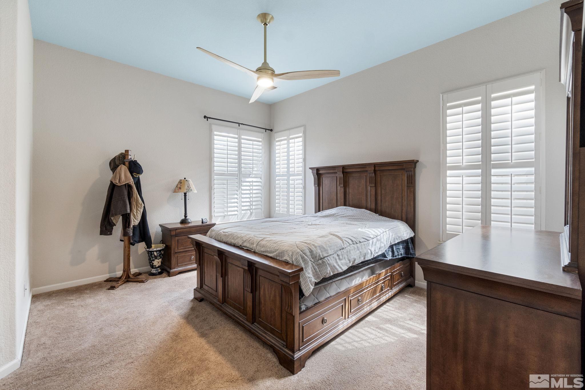 9607 Glen Ridge Drive Reno, NV 89521 - Photo 14 of 22 a bed sitting in a room next to a window