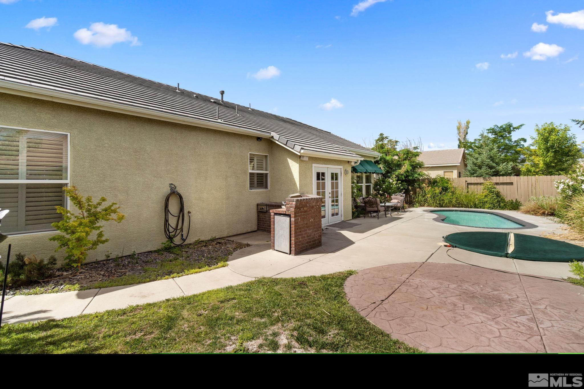 9607 Glen Ridge Drive Reno, NV 89521 - Photo 20 of 22 a view of a backyard with plants and a patio