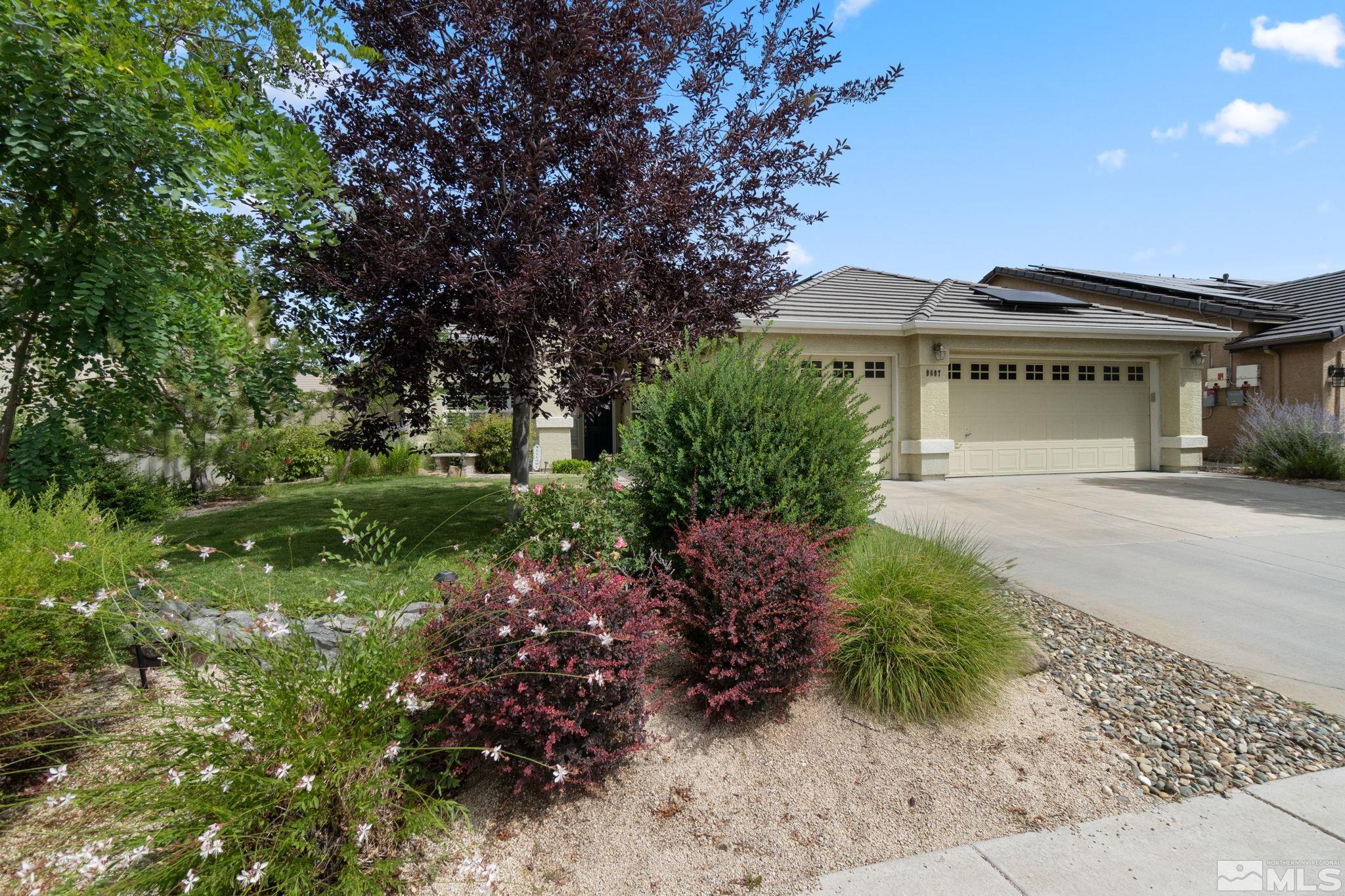 9607 Glen Ridge Drive Reno, NV 89521 - Photo 2 of 22 a front view of a house with a garden