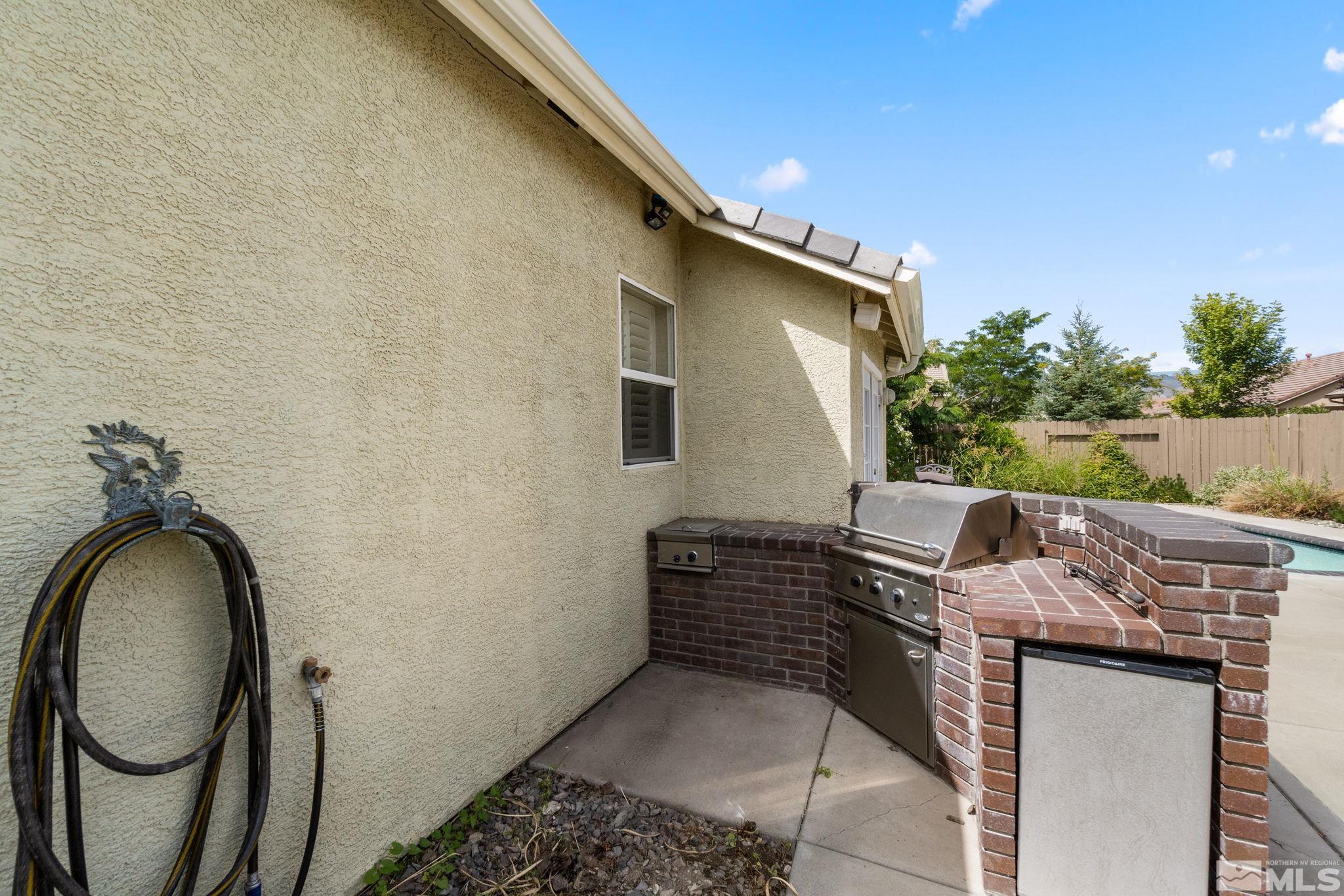 9607 Glen Ridge Drive Reno, NV 89521 - Photo 21 of 22 a backyard of a house with outdoor seating