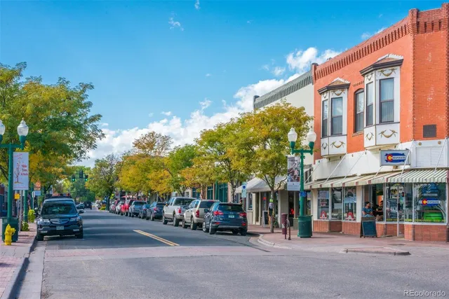 a view of a street with cars