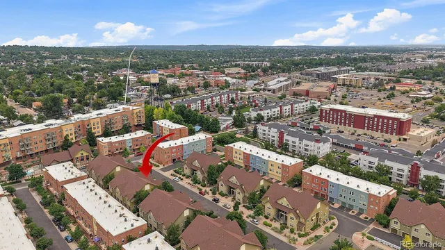 an aerial view of a city with lots of residential buildings