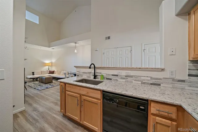 a kitchen with a sink and cabinets