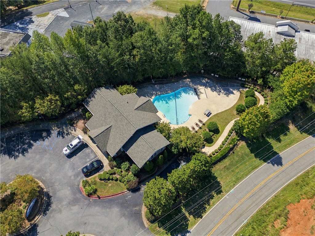 636 Lookover Drive Anderson, SC 29621 - Photo 4 of 34 Lush mature trees surround this beautifully maintained community clubhouse and sparkling pool facility.