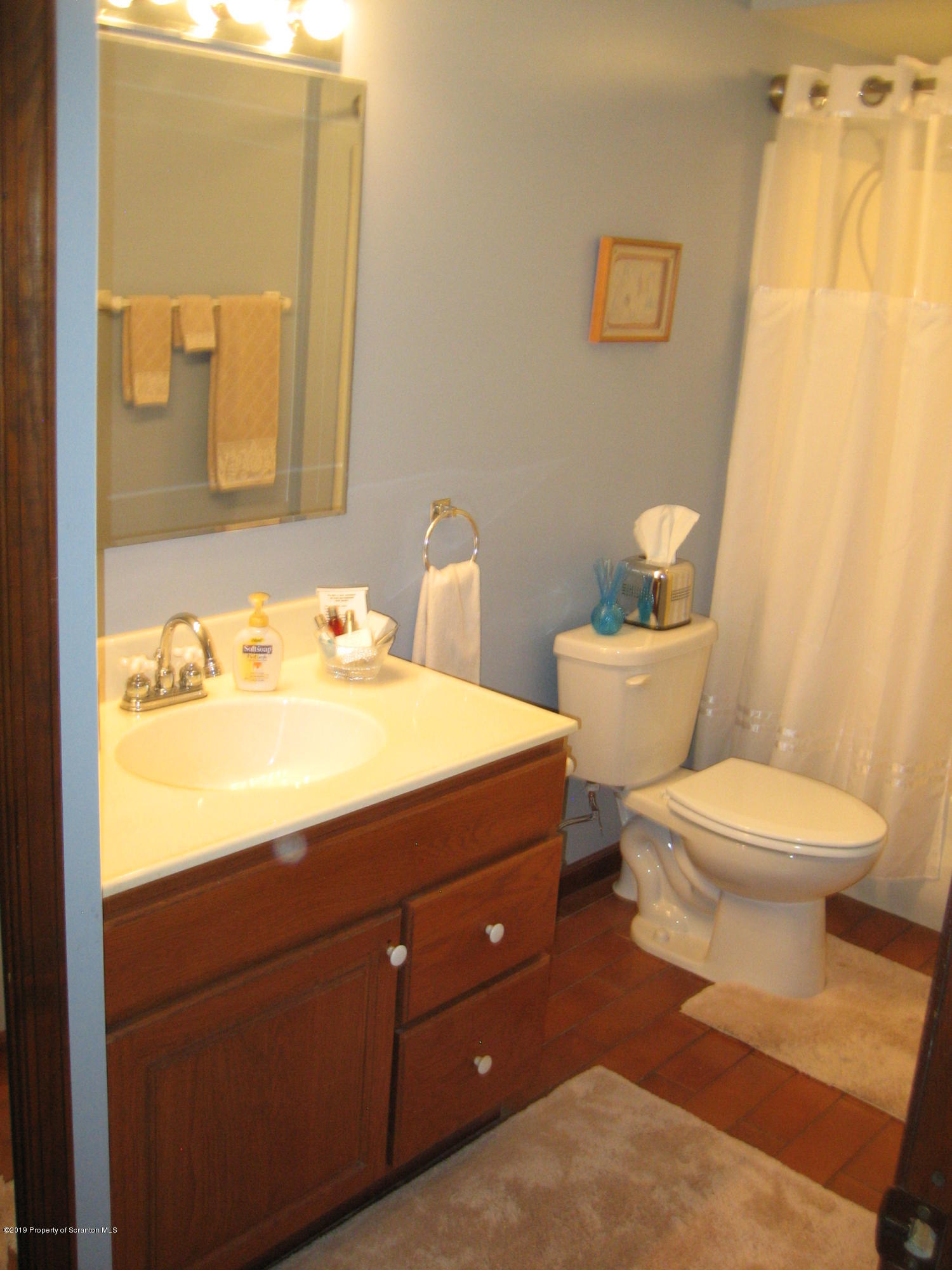 78 D Aberdeen Road Moscow, PA 18444 - Photo 24 of 70 a bathroom with a toilet sink and mirror