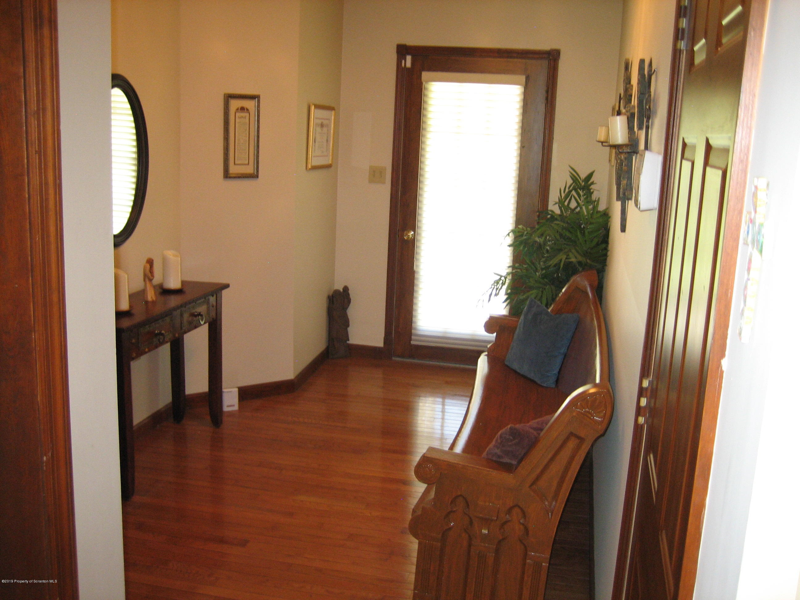 78 D Aberdeen Road Moscow, PA 18444 - Photo 28 of 70 a view of a hallway with furniture and wooden floor
