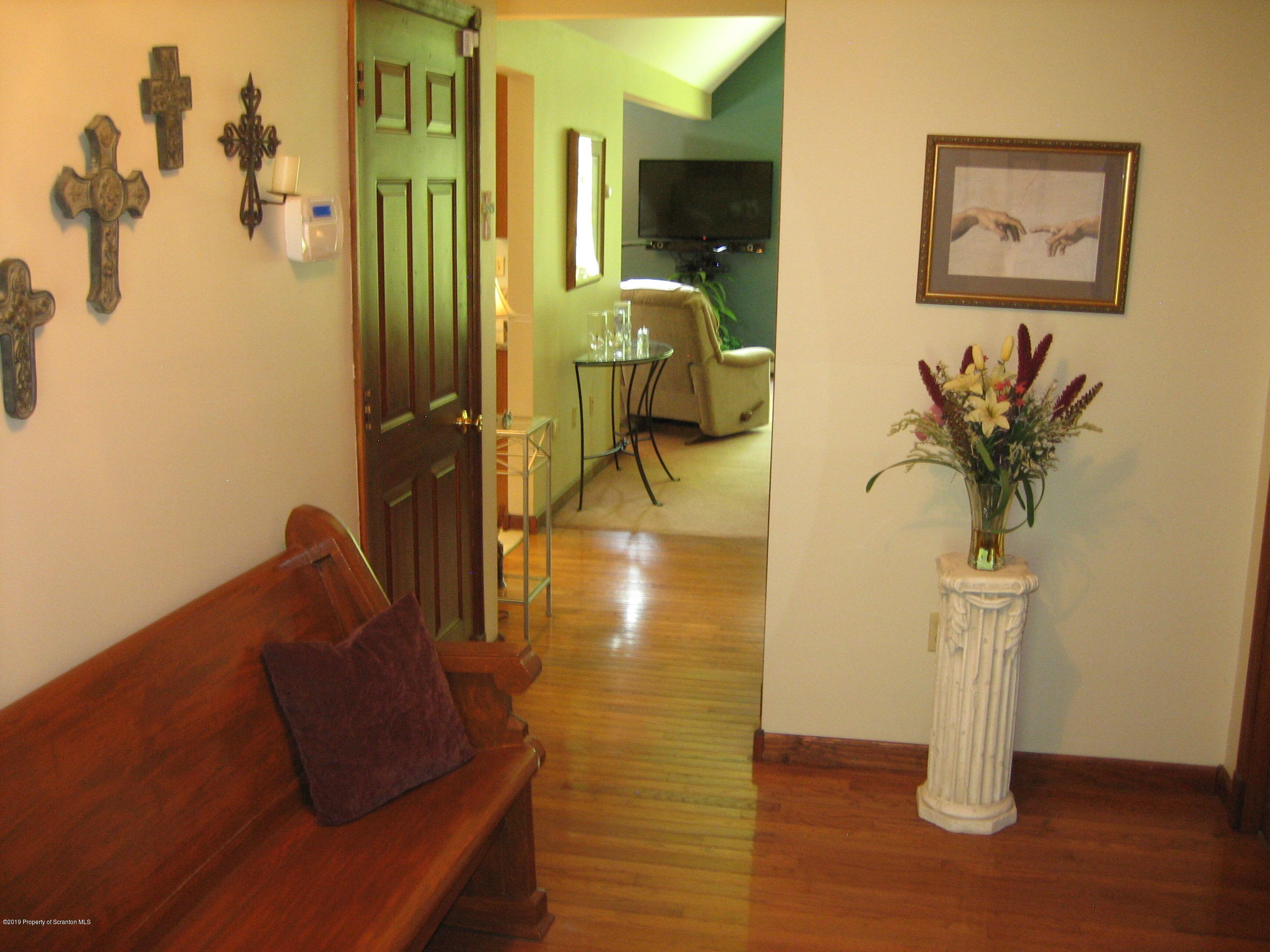 78 D Aberdeen Road Moscow, PA 18444 - Photo 29 of 70 a view of hallway with livingroom and couch