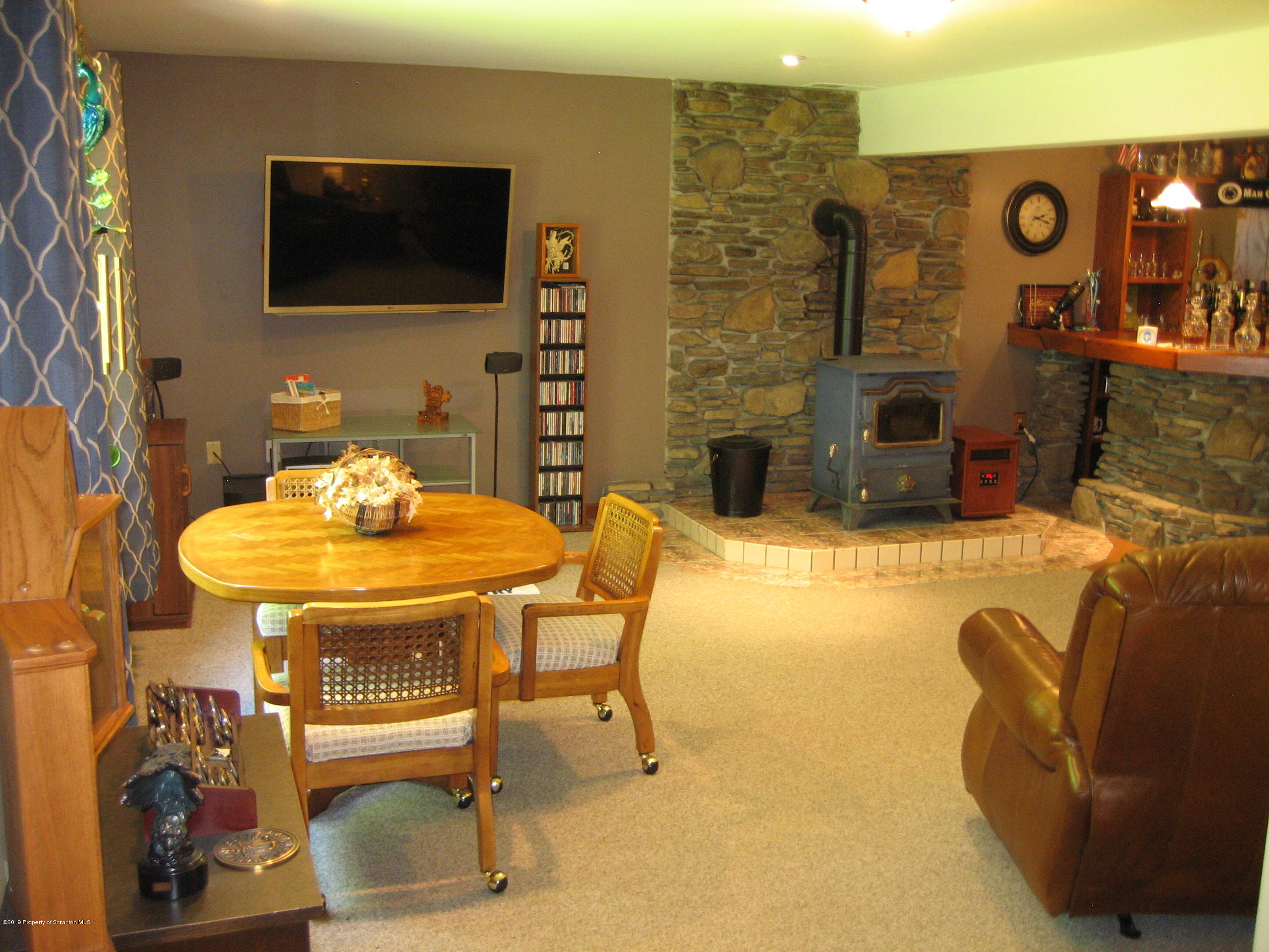 78 D Aberdeen Road Moscow, PA 18444 - Photo 35 of 70 a living room with fireplace furniture and a flat screen tv