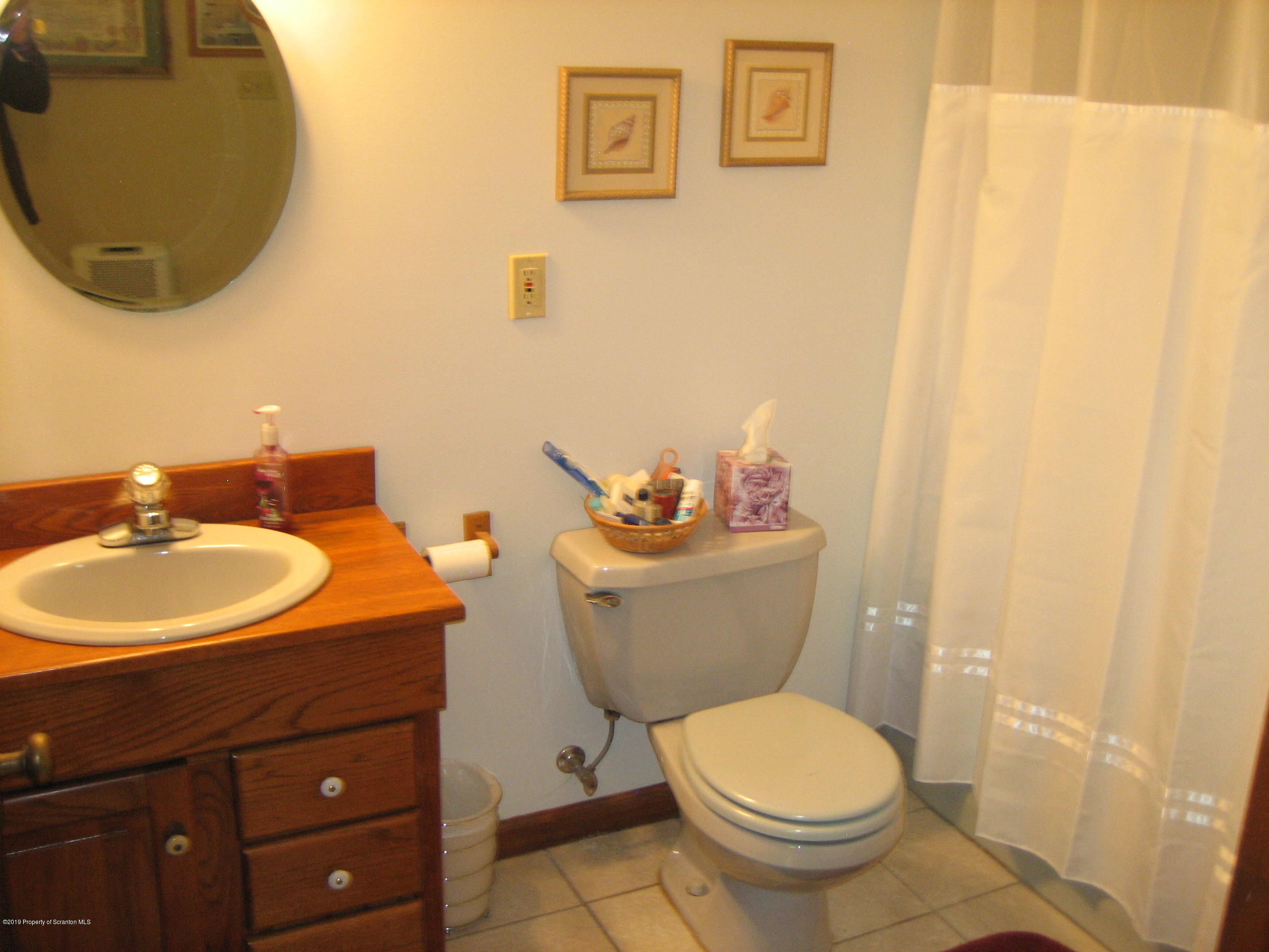 78 D Aberdeen Road Moscow, PA 18444 - Photo 38 of 70 a bathroom with a sink and a mirror