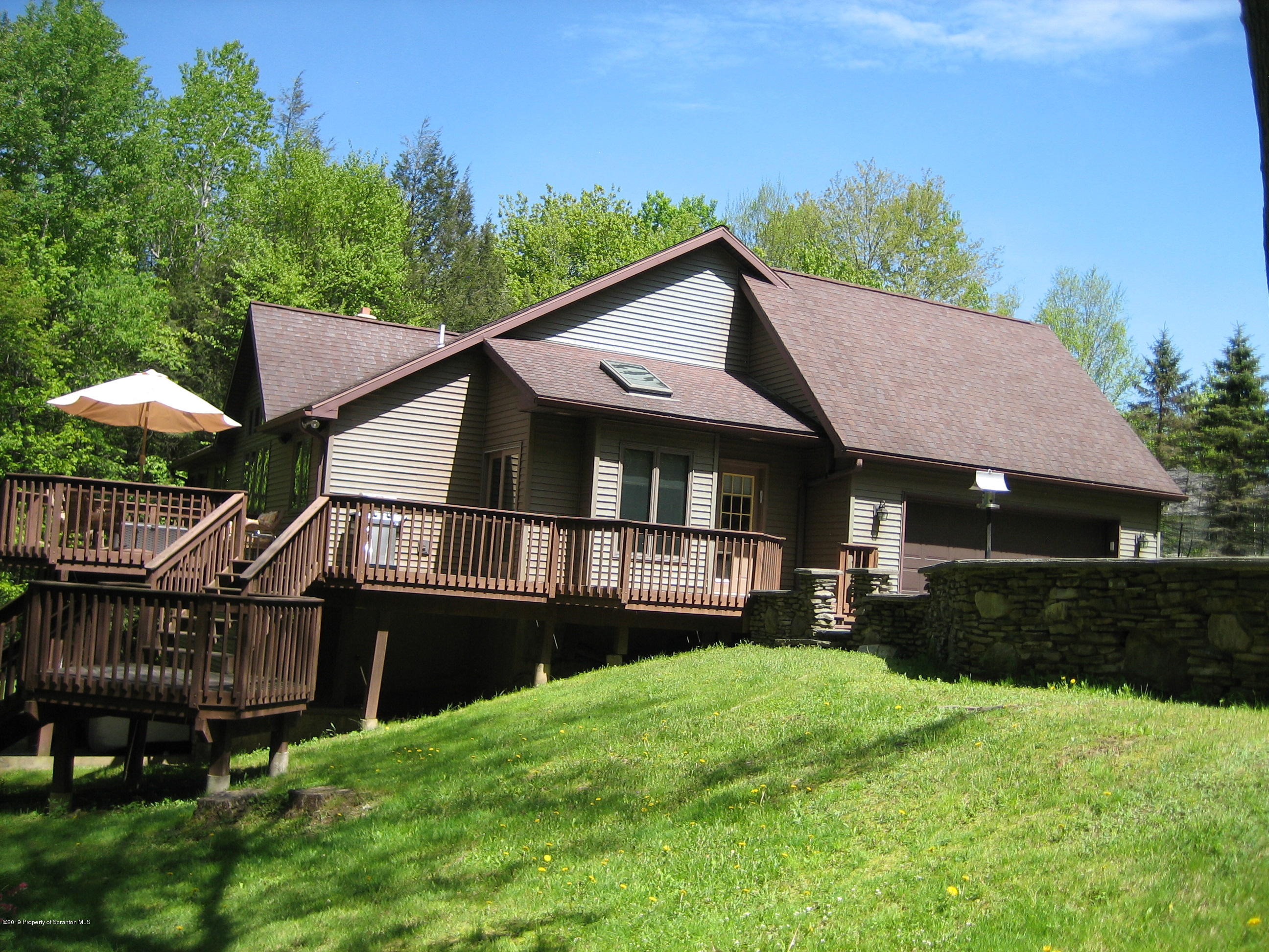 78 D Aberdeen Road Moscow, PA 18444 - Photo 51 of 70 a view of a house with wooden deck and furniture