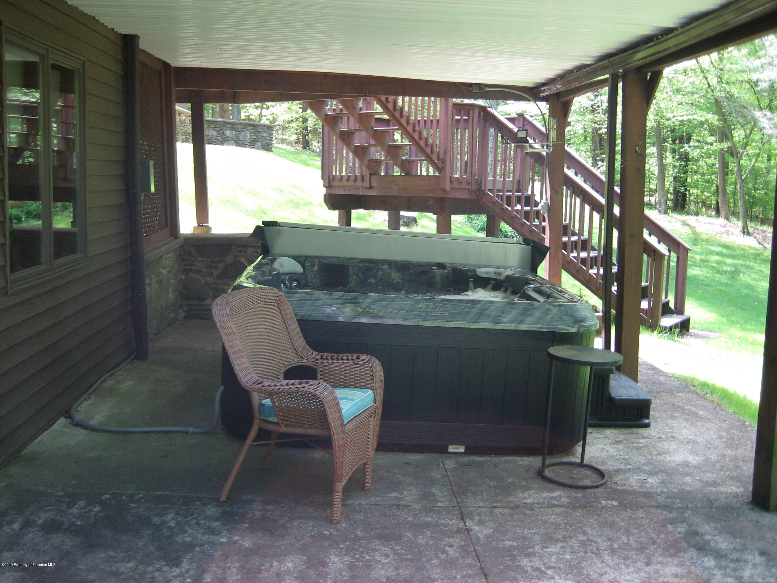 78 D Aberdeen Road Moscow, PA 18444 - Photo 56 of 70 a view of a chairs and table in the back yard of the house