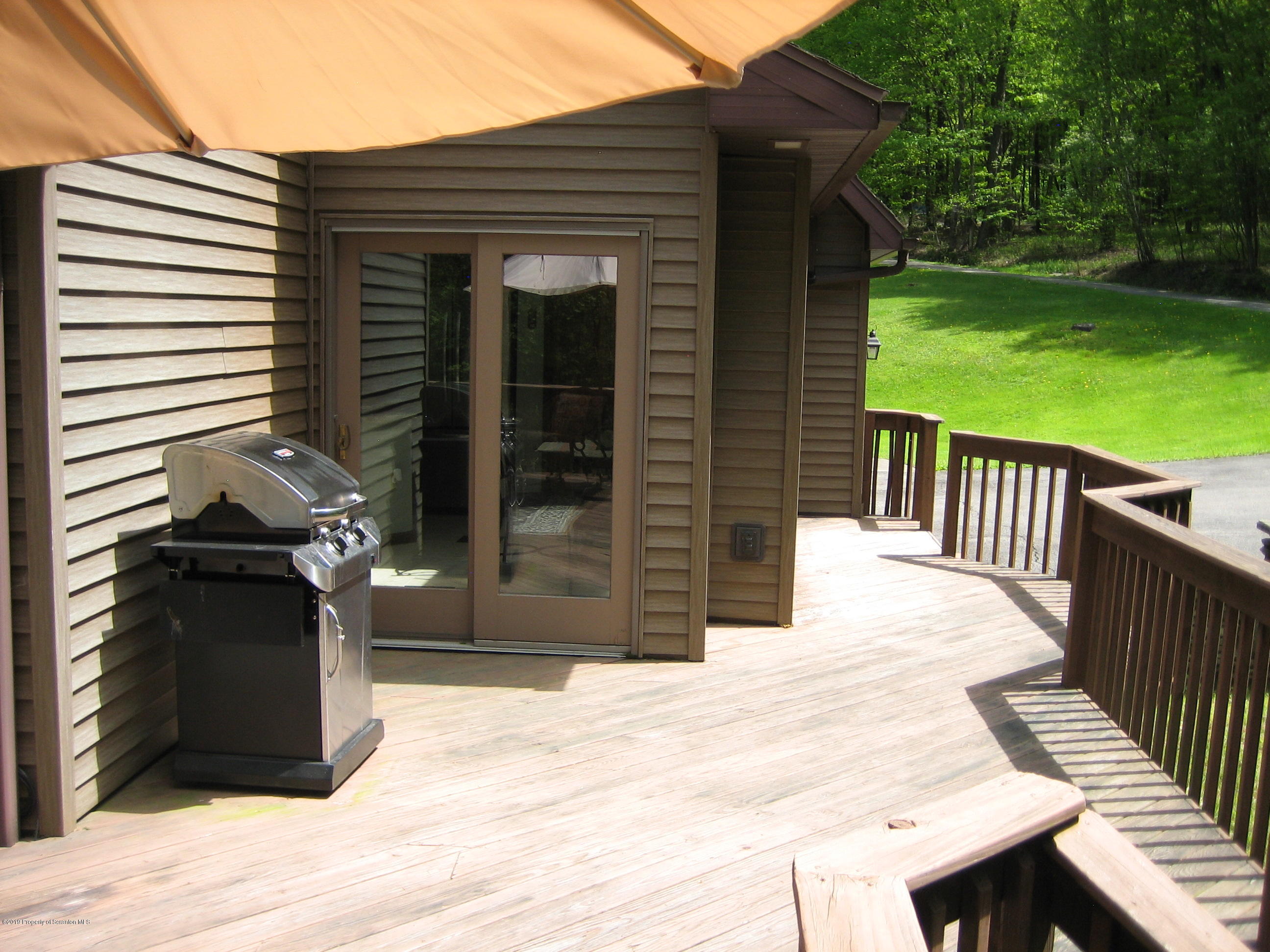 78 D Aberdeen Road Moscow, PA 18444 - Photo 66 of 70 a view of a patio on wooden deck and a backyard