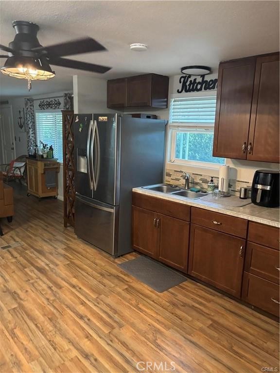 670 Channel Way Needles, CA 92363 - Photo 3 of 19 a kitchen with stainless steel appliances granite countertop a refrigerator a stove and a sink