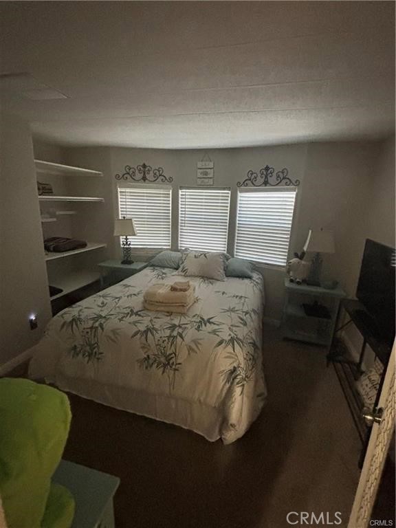 670 Channel Way Needles, CA 92363 - Photo 9 of 19 a bed sitting in a bedroom next to a window