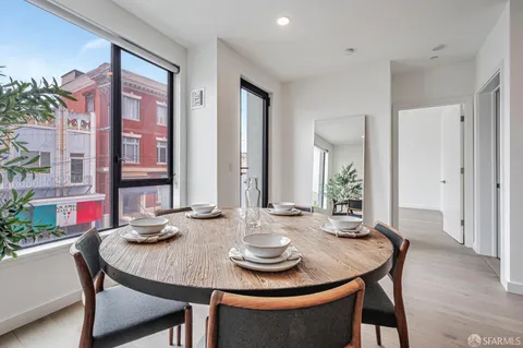 a view of a dining room with furniture and window