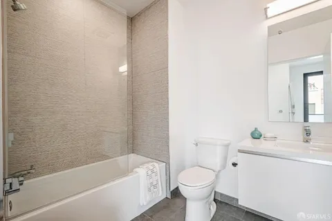 a bathroom with a sink toilet and bathtub