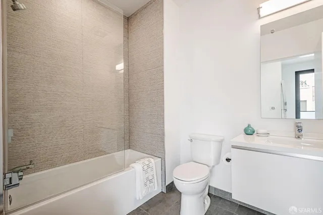 a bathroom with a sink toilet and bathtub