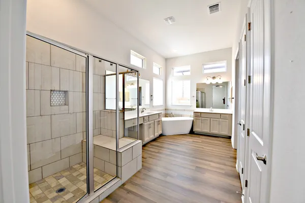 a large white room with white walls and glass door