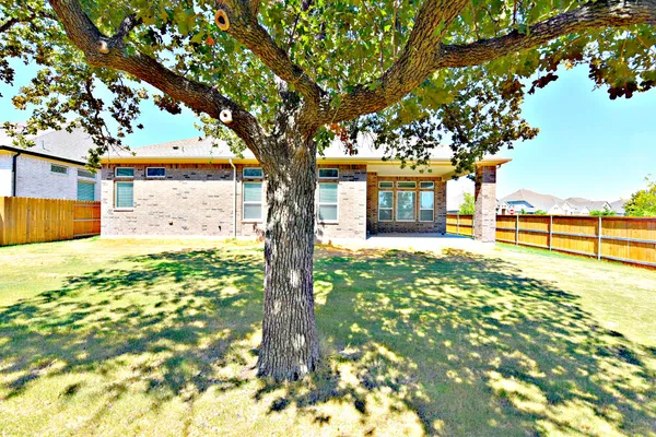 a view of a house with basketball court